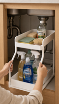 Person using 2-Tier Under Sink Organizer in a realistic lifestyle scene