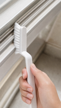 Person using Multi-Surface Gap Cleaning Brush in a realistic lifestyle scene