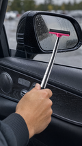 Person using Telescoping Car Mirror Wiper in a realistic lifestyle scene