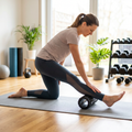 Person using a compact foam roller on a yoga mat