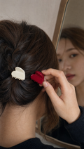Person using Heart Hair Claw Clips in a realistic lifestyle scene