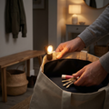 Person using a clip-on bag light inside a handbag