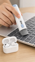 Person using 7-in-1 Keyboard Cleaning Kit in a realistic lifestyle scene