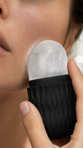 Person using Cooling Face Ice Roller in a realistic lifestyle scene